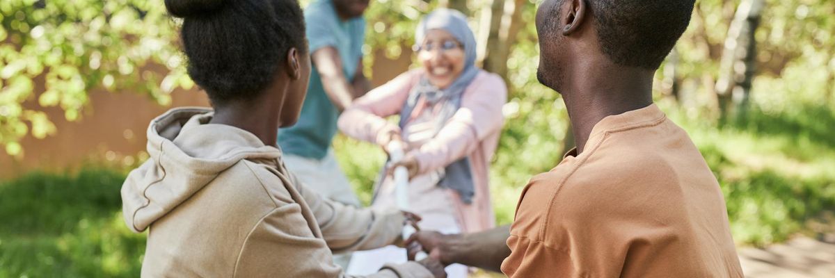 Group of diverse people smiling during outdoor exercise